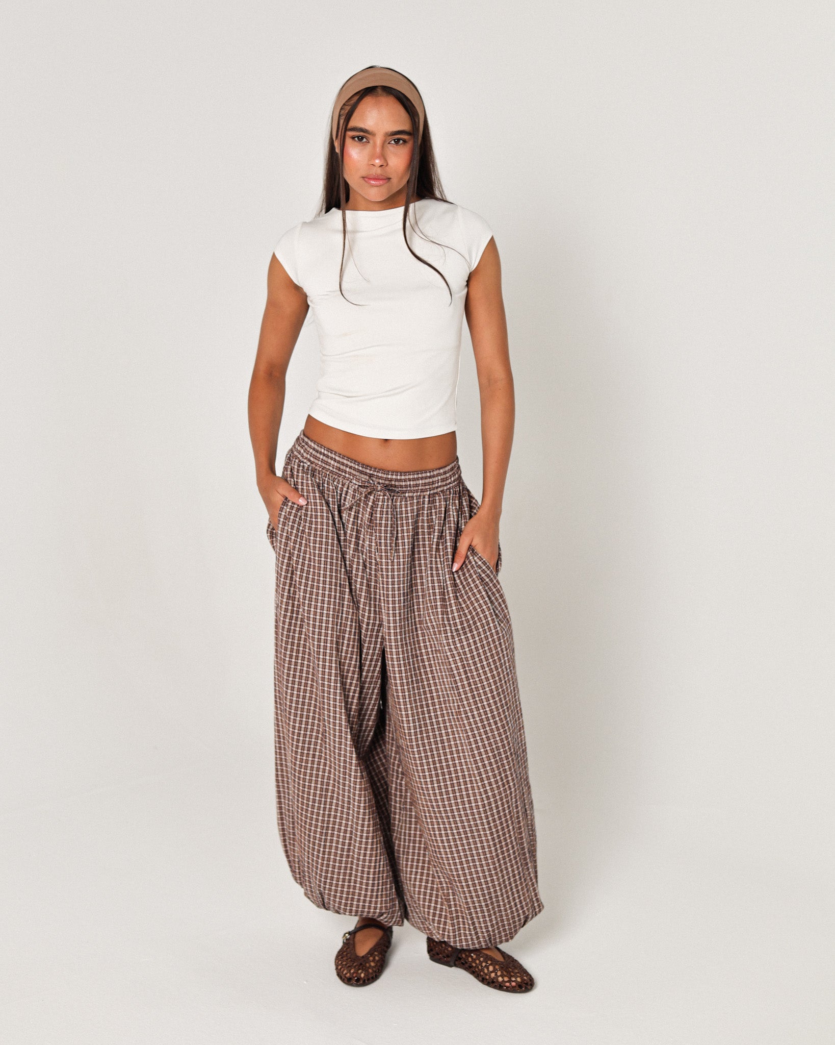 The brown plaid pants